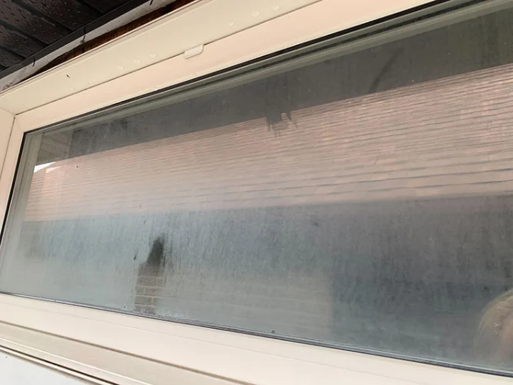 Window before professional cleaning
